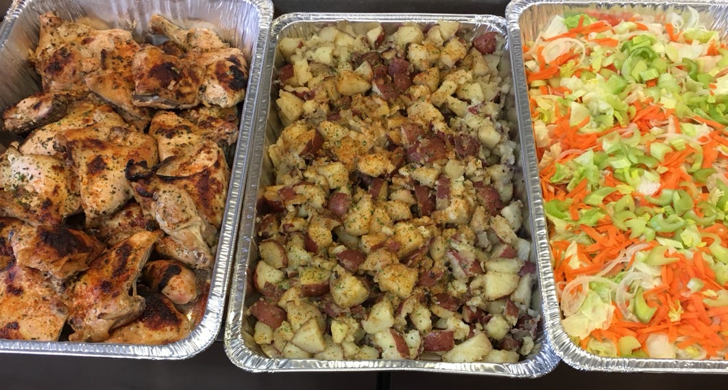Ronny's catering: pans of chicken, potatoes and salad